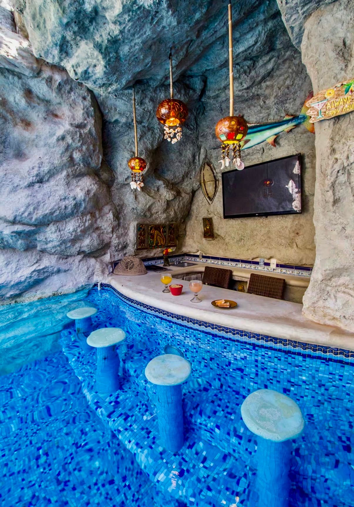 Prepare your own drinks while you hang out in your private grotto pool.